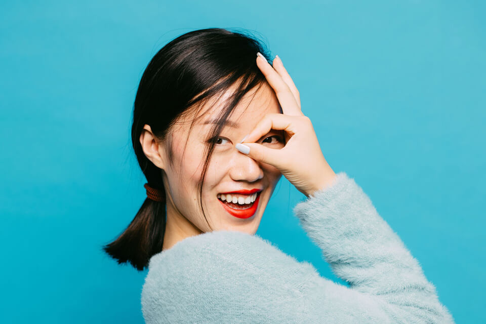 woman giving the 'okay' sign