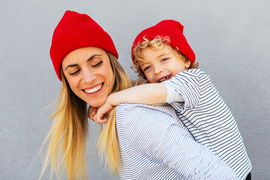 mom with child in red caps